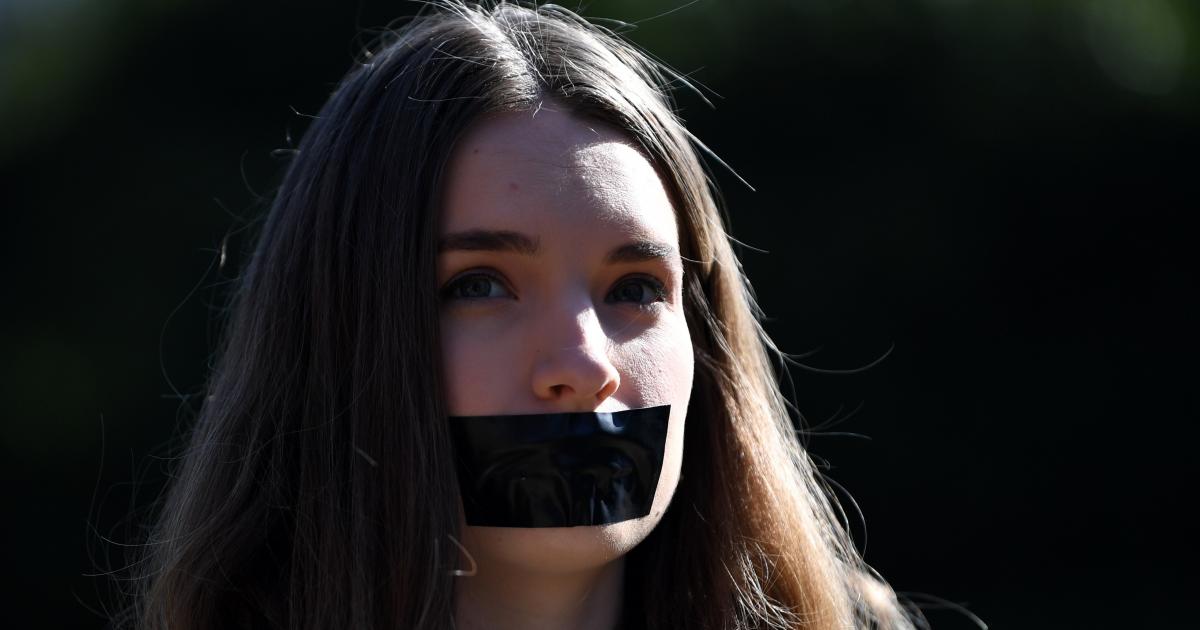 4 girl tape. Day of Silence Taped mouth.